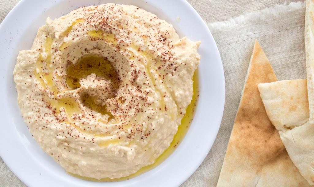 Hummus · Chickpeas based dipping, served with a pita bread.