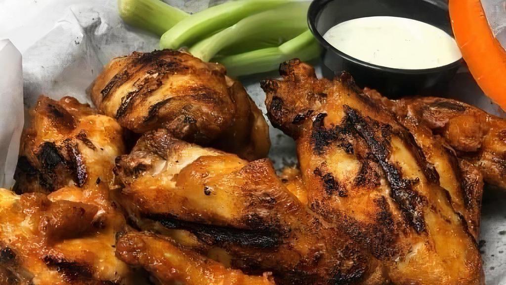 Famous Charbuff Wings (Half) · Famous Charbuff Wings - 6 of our famous wings taken to the next level tossed in sauce and finished on the grill! Your choice of buffalo , spicy, BBQ, baffque or ghost pepper (Additional $1) Served with carrots, celery, and ranch or blue cheese.
