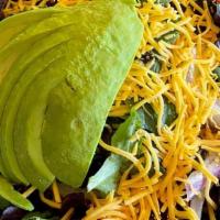 Fiesta Salad · Avocado, corn, beans, red onions, tomatoes, olives and cheddar cheese atop lettuce with cila...