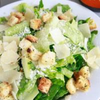 Caesar Salad · Romaine, garlic butter croutons, shaved parmesan, creamy Caesar dressing. Add breaded chicke...