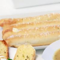 Garlic Butter Breadsticks · Served with your choice of homemade sauce: marinara, vodka, or alfredo.