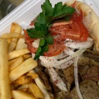 Gyro · Sliced grounded lamb come on pita bread with Taziki Sauce, tomatoes, onion.