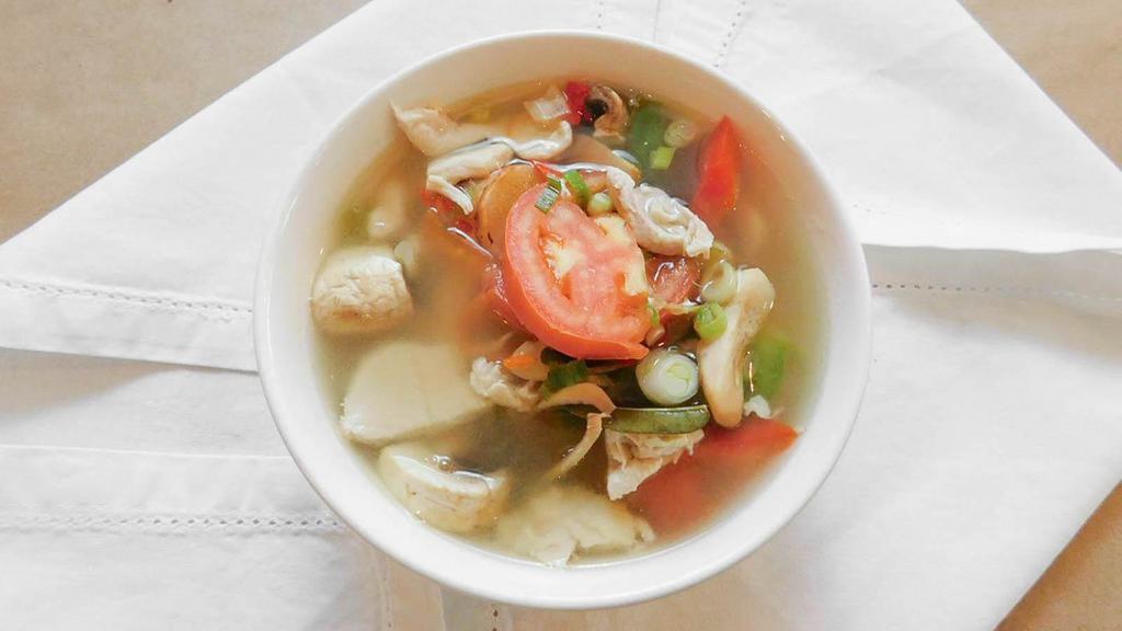Tom Yum (Small) · Thai hot and sour soup, made with lemongrass, galanga, lime leaves, onions, mushrooms and cilantro.