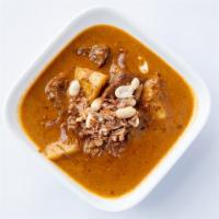 Massaman Curry · Gluten-Free, spicy. Onions, potatoes, and peanuts simmered in Massaman curry & coconut milk.