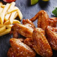 Hot Wings With Fries · Delicious chicken wings baked, then deep-fried to perfection and tossed in High-heat hot sau...