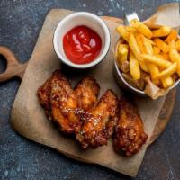 Bbq Wings With Fries · Delicious chicken wings baked, then deep-fried to perfection and tossed in BBQ sauce. Served...