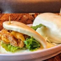 Fried Chicken Buns · Chicken karaage, spicy mayo sauce, organic Romaine, cilantro, and scallions stuffed in two s...