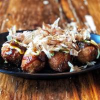Takoyaki · Grilled octopus ball served with Aodake special sauce, mayo and dried bonito flake.