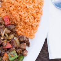 Steak A La Mexicana · Chopped skirt steak, onion, green pepper, tomato served with rice, beans, guacamole, pico de...