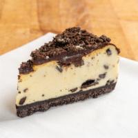 Oreo Cheesecake · New York style  cheesecake with Oreo chunks covered in chocolate

~1/2 lbs