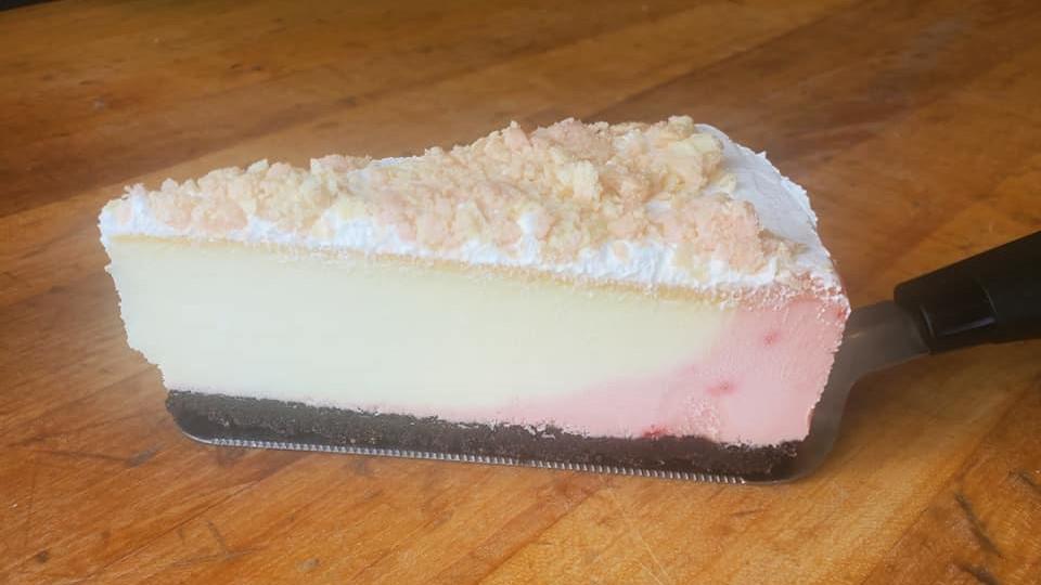 Strawberry  Sensation Cheesecake · Strawberry cheesecake with  strawberry wafer topping.