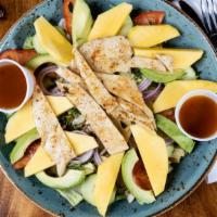 Mango Salad · Romaine lettuce, chicken breast sliced, fresh mango, avocado, red onions, cucumber, tomatoes...
