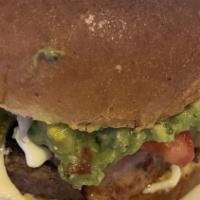 Super Lupita'S Burger · Everything on Lupita's burger plus ham, chorizo, guacamole, and cheese dip. Served with Fren...