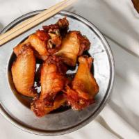 Chicken Wings · Soy sesame and ginger marinated chicken wings.