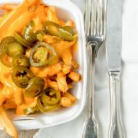Nacho Fries   Add $5.00 For Large · Great fries topped with cheese sauce and sliced jalapeños.