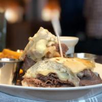 French Dip Sandwich · Slow roasted and thin-sliced roast beef, swiss cheese on a toasted baguette with au jus and ...