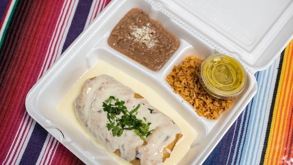 Chimichanga · Fried burrito filled with cheese, beans, rice, your choice of meat, and it is covered in queso