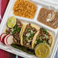 3 Street Tacos Lunch · Mexican Street tacos served with rice, beans, and a drink