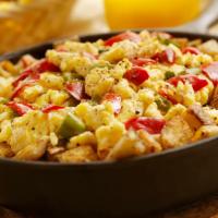 Mexican Breakfast Skillet · Chorizo, onion, jalapeno, green pepper, tomato, skillet potatoes, topped with cheddar/jack c...