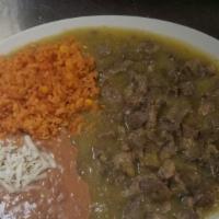 Guisado De Lengua · Tongue in red chile guajillo, or green sauce. Served with rice and beans.