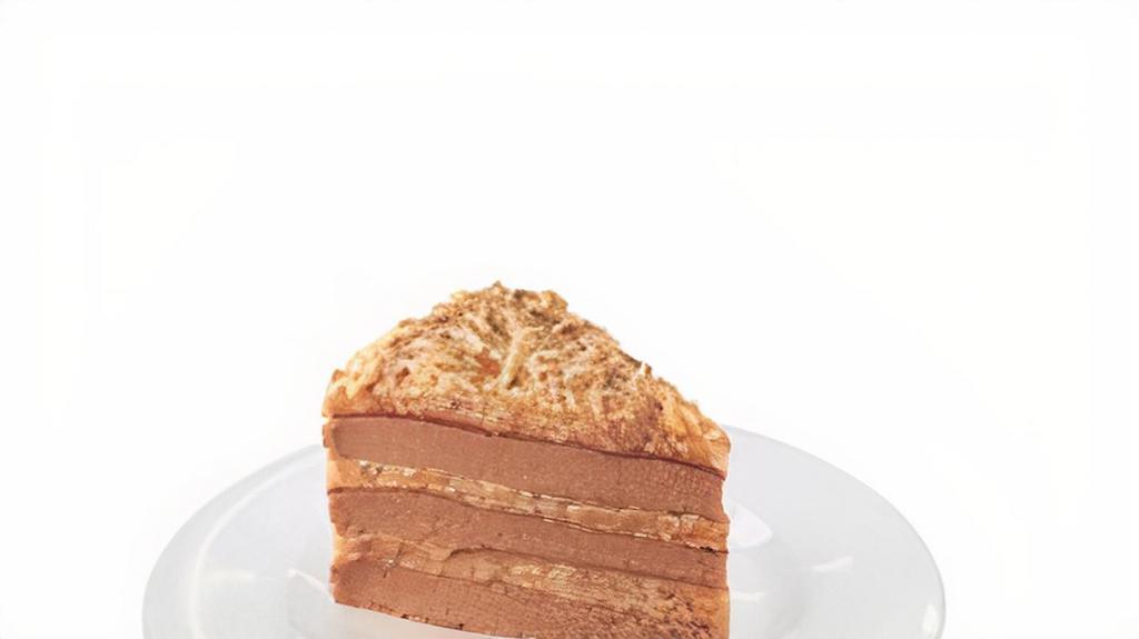 German Chocolate Cake · Three layers of chocolate cake filled with an icing of caramel coconut, pecans and sided with chocolate smooth icing