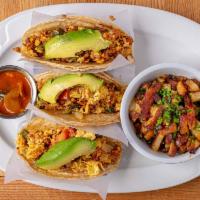 Mad Morning Tacos · 3 soft corn tortilla tacos stuffed with scrambled eggs, chicken chorizo, tomato, poblano pep...