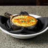 French Onion Soup · prepared with a trio a sweet caramelized onions.