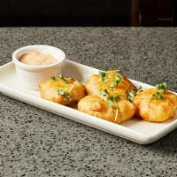 Crab Beignets · Lump crab meat, mascarpone, chives, remoulade.