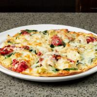 Tuscan Pizza · Pesto ricotta, red bell pepper, kale, sliced tomato, four cheese blend.
