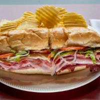 Roast Beef Dagwood · A generous portion of top quality deli meat stacked high on a toasted italian loaf topped wi...