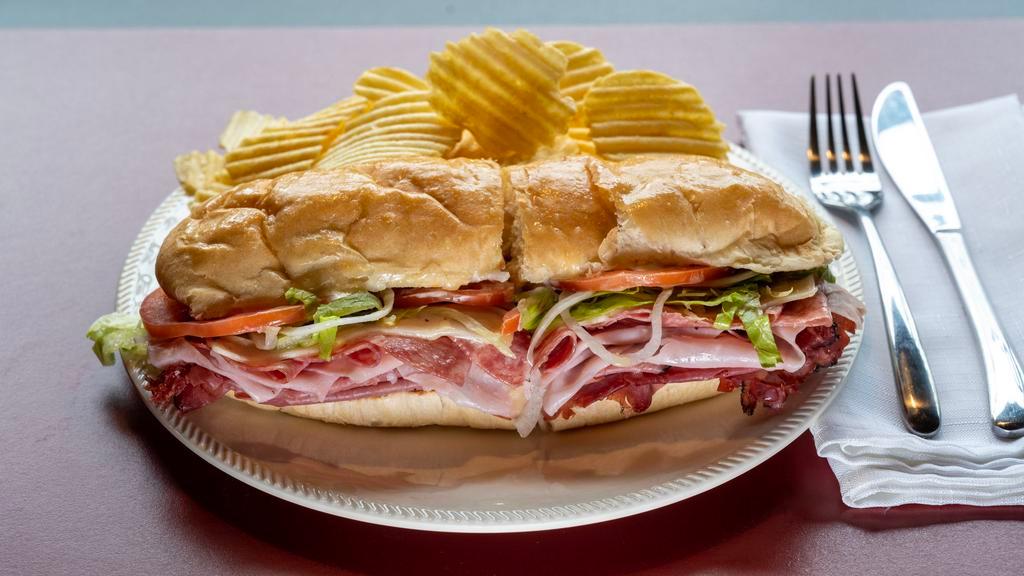 Roast Beef Dagwood · A generous portion of top quality deli meat stacked high on a toasted italian loaf topped with melted cheese lettuce onions tomatoes mayonnaise and dagwood’s special dressing. served with potato chips or side salad.
