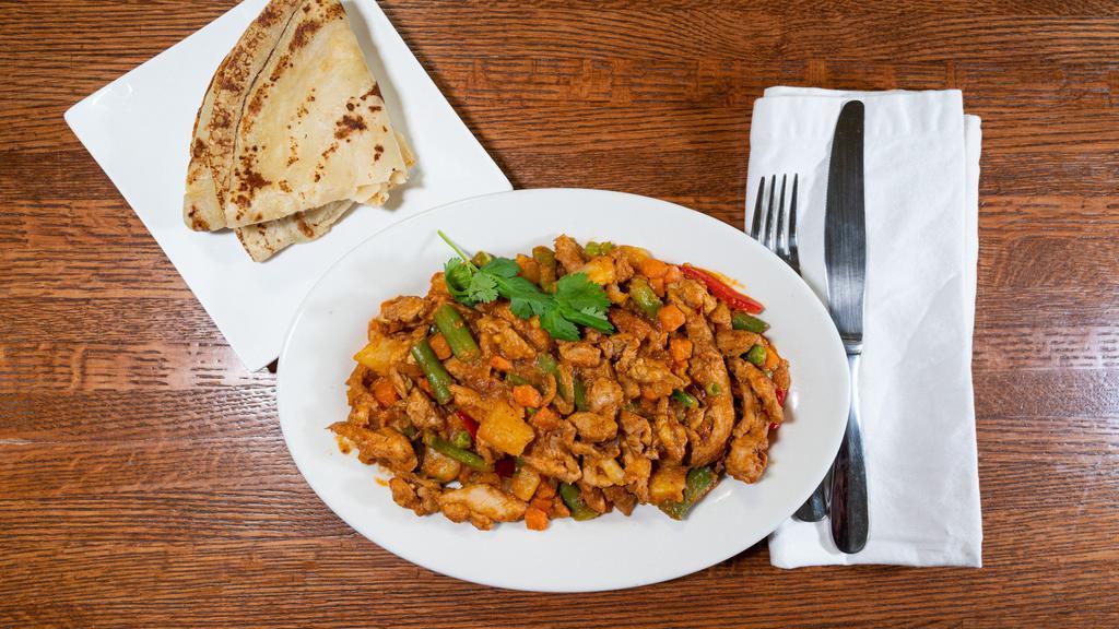 Chicken Suqaar & Malawax · Chicken Suqaar: cubes of chicken breast cooked with vegetables and spices;
Malawax: thin bread similar to pancakes & crepes;
(Meal includes a drink.)