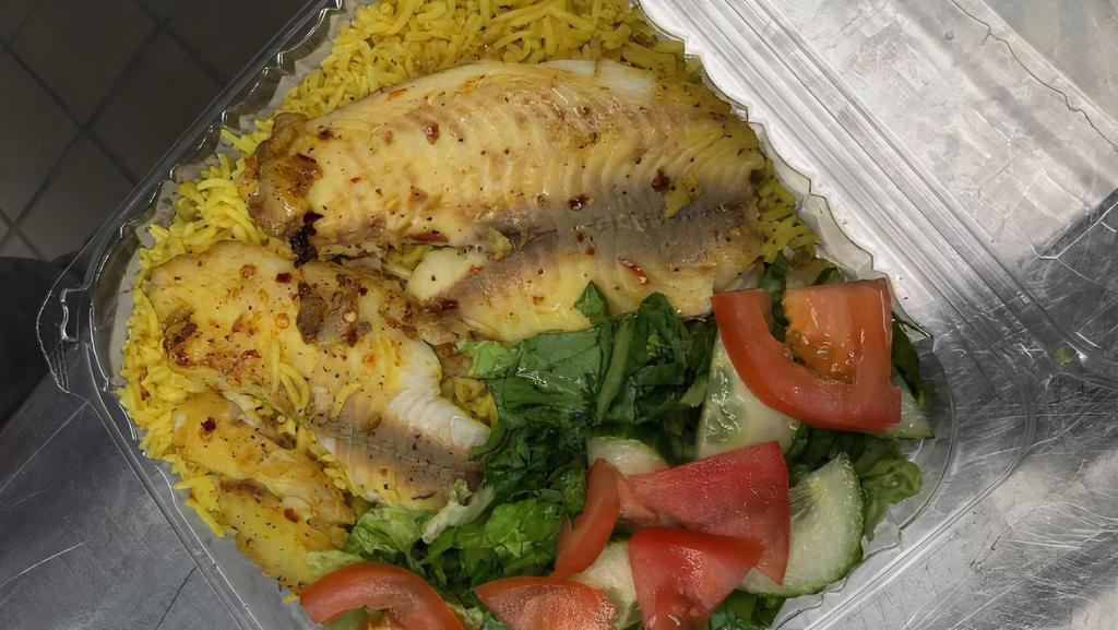 Fish & Rice · Fish: tilapia fillets grilled with lemon juice and spices;
Rice: basmati rice cooked with onions, garlic, and spices;
(Meal includes a salad, a drink, and a banana.)