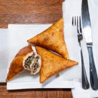 Beef Sambusa/Samosa · Fried pastry filled with ground beef.