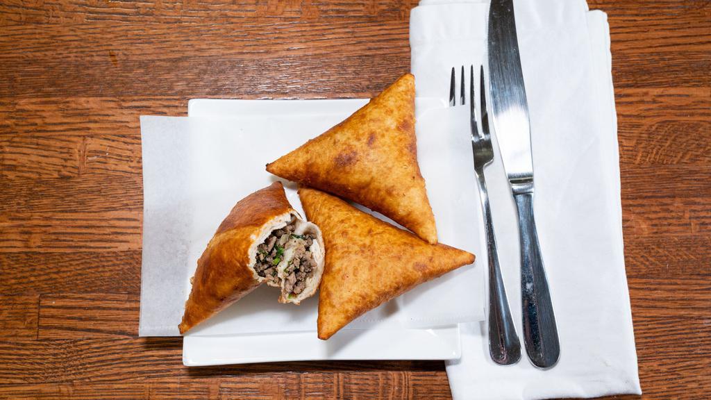 Beef Sambusa/Samosa · Fried pastry filled with ground beef.