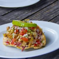 Ceviche Tostada · Gluten free. Raw lobster and shrimp marinated in a aji amarillo sauce, spiced with agave, li...