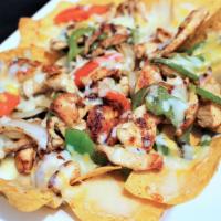 Fajita Nachos · New! Crispy chips with cheese sauce and shredded cheese and your choice of meat cooked with ...