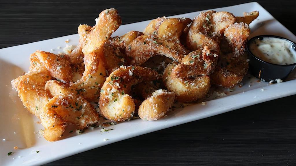 Truffle Fries · Our delicious coated fries topped with truffle salt and herbs.  Served with rosemary aioli