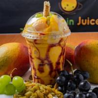 Arisi · Mango smoothie with mixed berry syrup around the Cup and, on the  top fresh fruit cuts which...