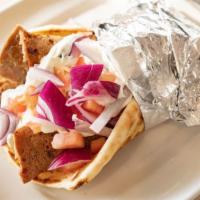 Gyro Sandwich · A blend of seasoned, thinly sliced beef & lamb with tomatoes, onions & tzatziki sauce in a p...