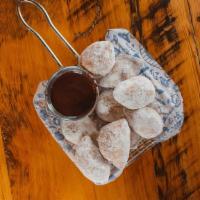 Oliebollen · Old fashioned Dutch doughnuts,. cinnamon-sugar dusting, chocolate sauce