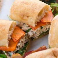 The Tuna Salad Sub · Delicious sub sandwich made with seasoned tuna, mayonnaise, fresh lettuce, and sliced tomato...