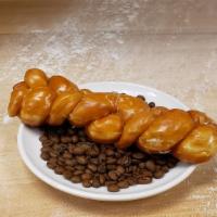 Coffee Braid · A doughnut braid dusted with cinnamon, and glazed with Indie Coffee Roasters coffee glaze