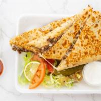 Quesadilla Gigante · Includes lettuce, tomatoes, and sour cream. Add avocado for an additional charge.