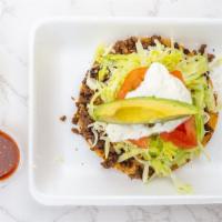 Tostadas · Includes: lettuce, tomatoes, cheese, beans, sour cream and avocado.