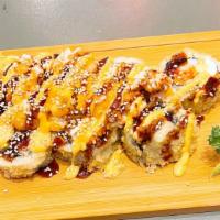 Volcano Roll · Tempura with spicy tuna, white fish, avocado and cream cheese topped with grilled scallops c...
