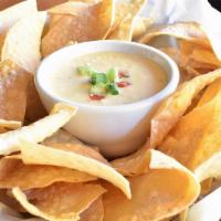 Chips And Queso · House-made chips/creamy queso dip/pico de gallo Gluten Friendly*