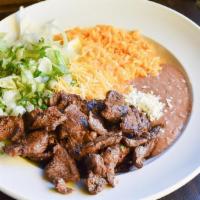Steak Bowl · Marniated flank steak/cilnatro and onion/house-made rojo sauce/queso fresco/rice/colby jack ...