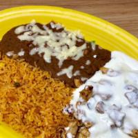 Pollo Con Crema · Chicken strips cooked in sour cream sauce and served with rice, beans and tortillas.