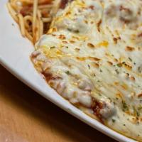 Chicken Parmesan · Breaded chicken breast topped with meat sauce and mozzarella cheese over spaghetti noodles